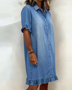 Detailed side view of a light blue denim shirt dress featuring feminine ruffle hems