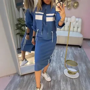 Full detail view of a stylish blue casual jacket and skirt set with white stripe accents