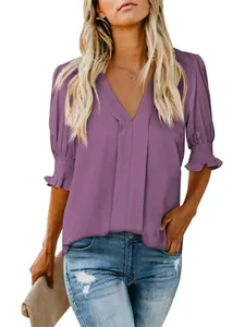 Elegant purple V-neck short sleeve blouse featuring stylish smocked ruffle cuffs