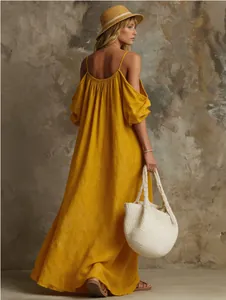 Elegant mustard yellow cold-shoulder maxi dress in a relaxed cotton-linen blend fabric
