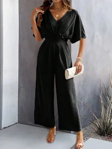 Elegant black short-sleeve wide-leg jumpsuit with a V-neckline and pleated texture
