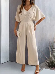 Elegant women's beige V-neck wide-leg jumpsuit with short batwing sleeves for summer