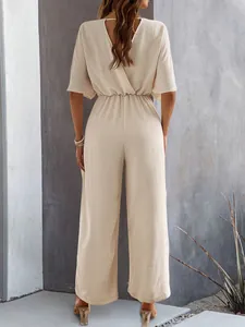 Detailed back view of an elegant beige short sleeve wide leg jumpsuit for summer wear