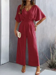 Elegant wine red V-neck jumpsuit with short sleeves and a high waist wide-leg design.