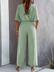 Detailed back view of a sage green short-sleeved wide-leg jumpsuit with V-neck design.