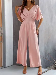 Elegant pink short sleeve V-neck wide leg jumpsuit for women shown on a fashion model