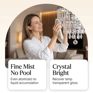 Woman cleaning a luxury crystal chandelier with lamp care spray for a transparent gloss.