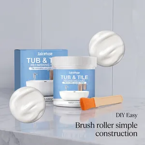 View of white tile refinishing paint jar and box with application brush on marble table
