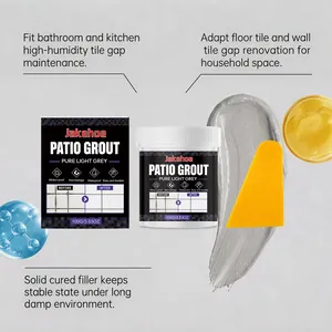 Detailed view of Jakehoe pure light grey patio grout jar with texture smear and scraper tool