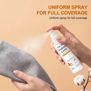 Close-up of fabric care spray being applied to grey textile for uniform coverage