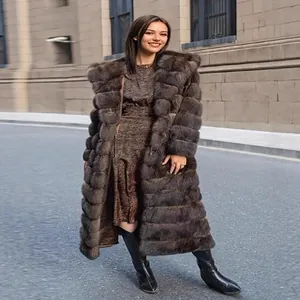 Elegant long brown faux sable fur coat with hood for women's winter fashion and warmth.