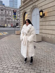 Luxurious long white faux fur winter coat for women in elegant urban street style fashion