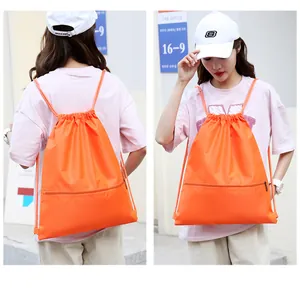 Orange Oxford drawstring gym backpack with front zipper shown on a model, front and back view