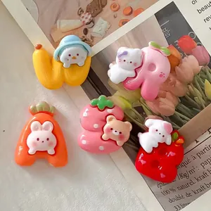 Close-up of colorful resin animal and fruit charms for DIY accessories and jewelry.