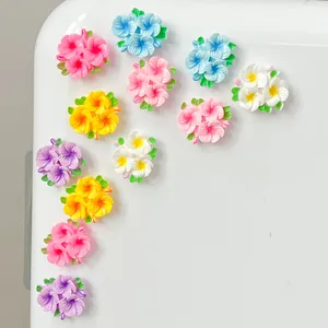 High-detail macro view of colorful glossy resin flower charms for DIY jewelry