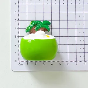 Detailed macro view of green resin dessert bowl magnet on a measurement grid for size reference
