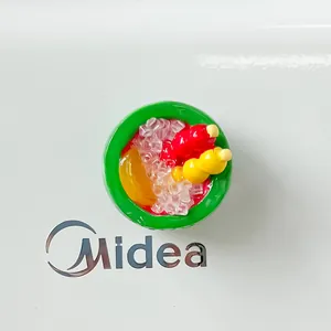 Macro detail of resin dessert bowl refrigerator magnet with skewers