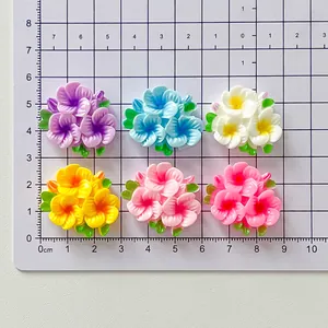 Detailed view of glossy colorful resin flower patches on a metric measurement grid