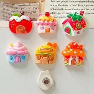 Close-up of colorful resin miniature house charms with strong magnets for DIY crafts