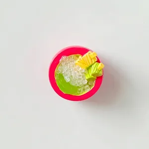 Detailed top view of a miniature resin food bowl charm featuring mango and jelly