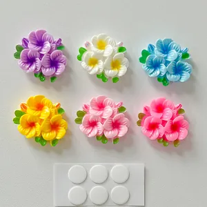 Set of six colorful glossy resin flower charms with double-sided adhesive dots for DIY crafts.