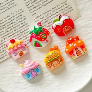 Close-up detail of colorful cartoon resin fruit and mushroom house charms for DIY crafts