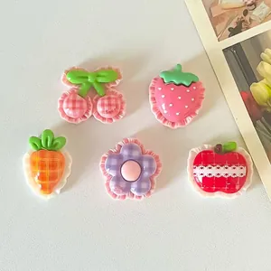 Close-up of cute resin fruit charms with lace edges for DIY jewelry accessories