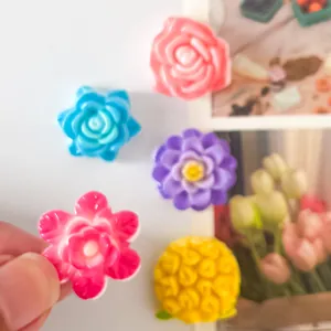 Close-up of colorful glossy flower resin accessories for DIY phone cases and jewelry