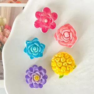 Detail showing colorful glossy resin flower charms for DIY crafts and phone cases