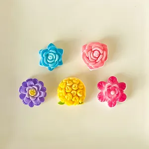 Assortment of five colorful glossy resin flower charms for DIY crafts and accessories