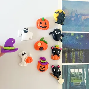 Close-up of various colorful Halloween resin charms for DIY crafts and accessories