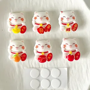 Set of 6 cute Maneki-neko charms with lucky characters and 6 round adhesive pads.