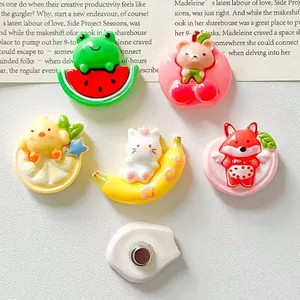Detailed view of various cute cartoon resin charms with magnetic backing for DIY projects