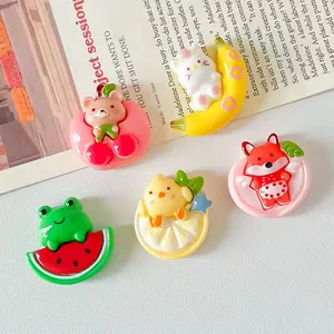 Detailed macro shot showing colorful resin animal and fruit charms for DIY accessories crafts