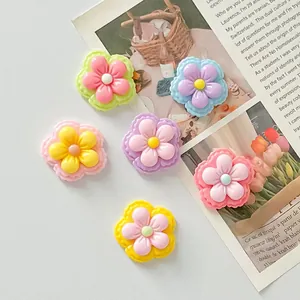 Macro view of colorful glossy two-color five-petal flower resin DIY accessories