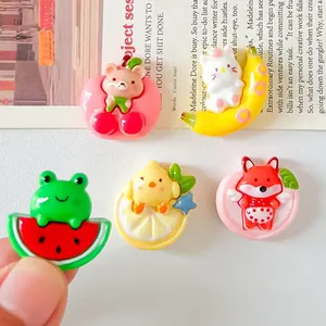 Close-up of cute cartoon animal and fruit resin charms for DIY accessories
