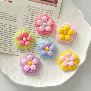 Macro view of colorful double-layered resin flower charms for DIY jewelry and crafts