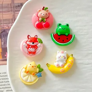 Detailed macro view of five cute cartoon animal resin charms with glossy fruit and heart designs