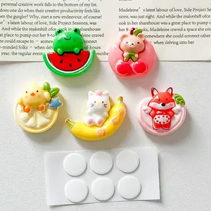 Macro detail view of diverse cute cartoon animal resin charms with round adhesive stickers