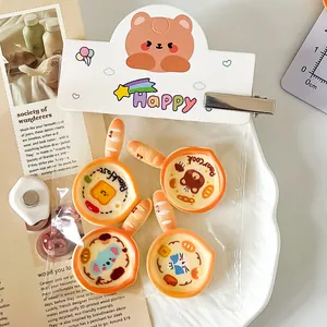 Close-up of cute cartoon frying pan resin charms for fridge magnets and DIY crafts