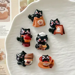 Detailed view of six cute black cat resin charms with a coffee and bakery theme for DIY