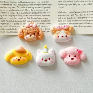 Detailed view of five cute resin dog head charms with various colorful designs.