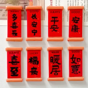 Close-up of miniature red scroll resin charms with traditional Chinese blessing words