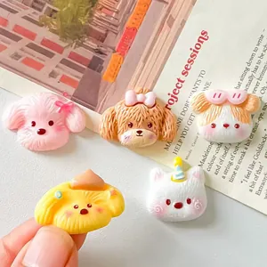 Close-up of cute cartoon dog resin accessories for hair clips and fridge magnets
