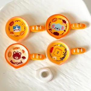Close-up of cute cartoon frying pan resin fridge magnets with animal designs