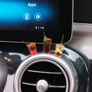 Miniature coffee drink car dashboard ornaments showing placement on center console screen.