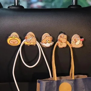 Ganchos de coche Capybara de dibujos animados en el respaldo para cables y bolsos