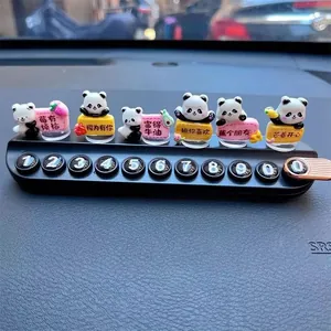 Close-up of cute panda car temporary parking phone number plate for dashboard decor