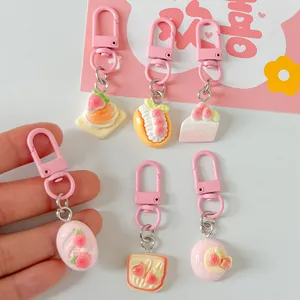 Detailed view of six cute pastel simulation food dessert keychain charms for bags.