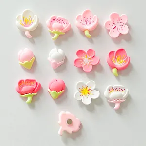 Detailed view showing variety of resin cherry blossom magnets with functional magnetic backs